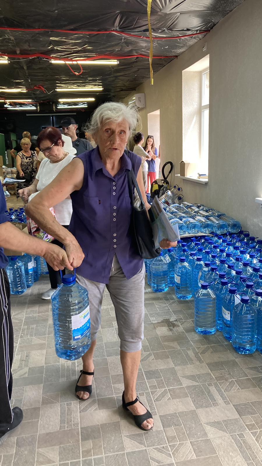 Ukraine Old Lady with water